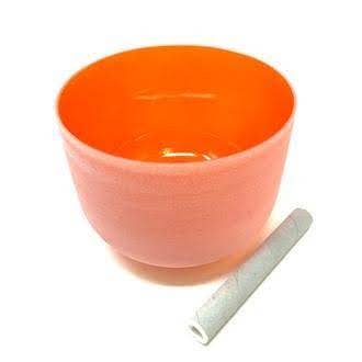 Orange singing bowl with a white rod on a white background - JOY - Journey Of You - Spiritual, Holistic, Empowering