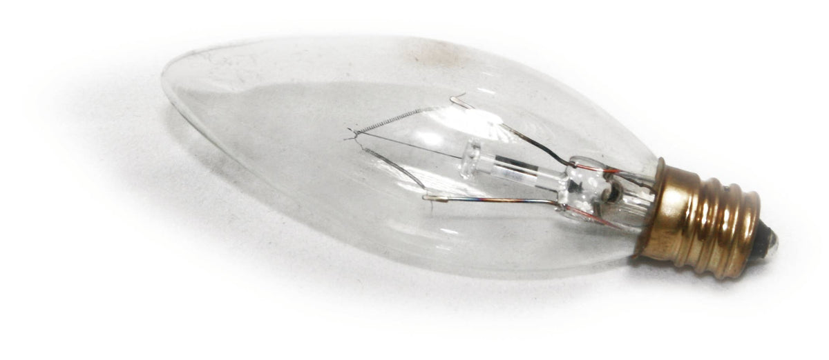 Clear light bulb with a brass base on a white background