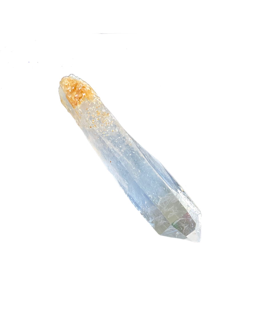 A Colombian clear crystal quartz point with a natural golden bottom against a white background - JOY - Journey Of You - Spiritual, Holistic, Empowering