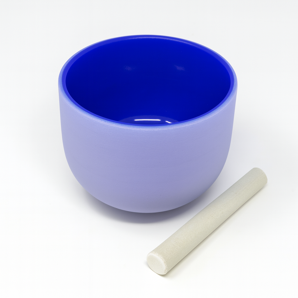 Blue ceramic bowl with a white stick on a white background