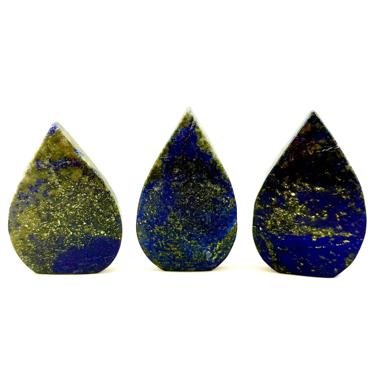 Three teardrop-shaped stones with blue and green patterns on a white background