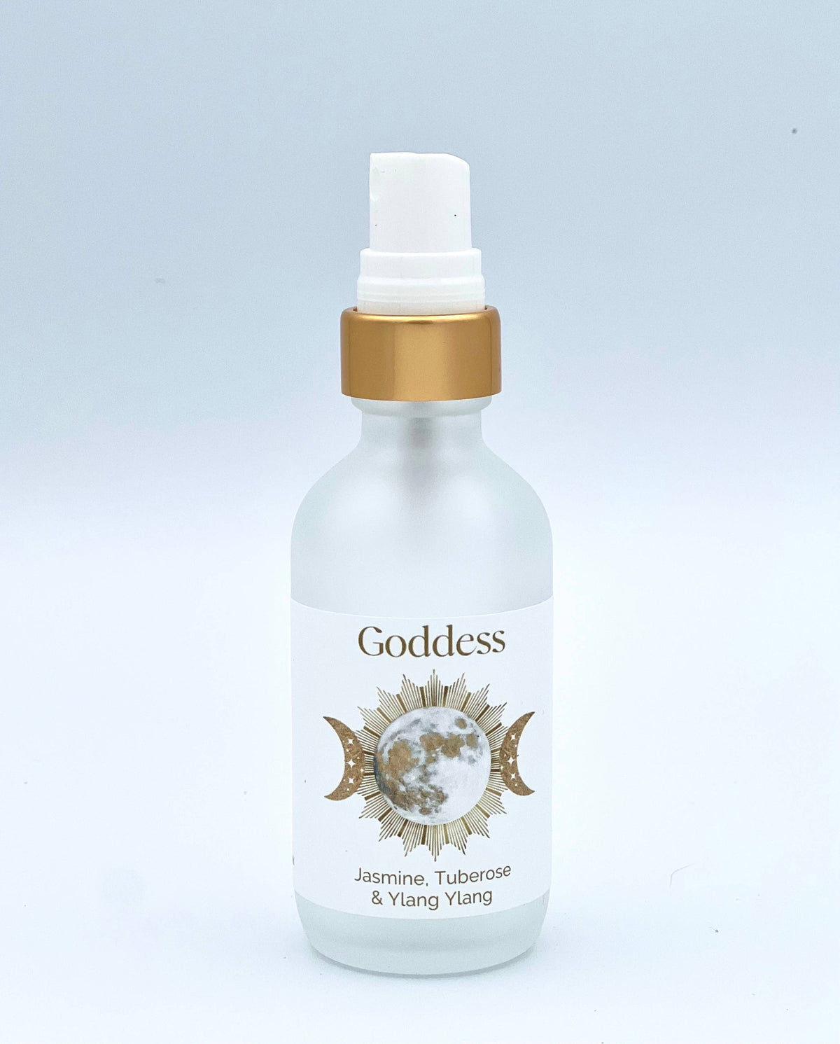 White bottle with gold cap labeled 'Goddess' on a light gray background