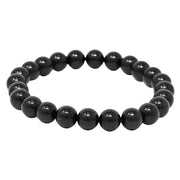 A black tourmaline bracelet with elastic string, featuring glossy black beads.
