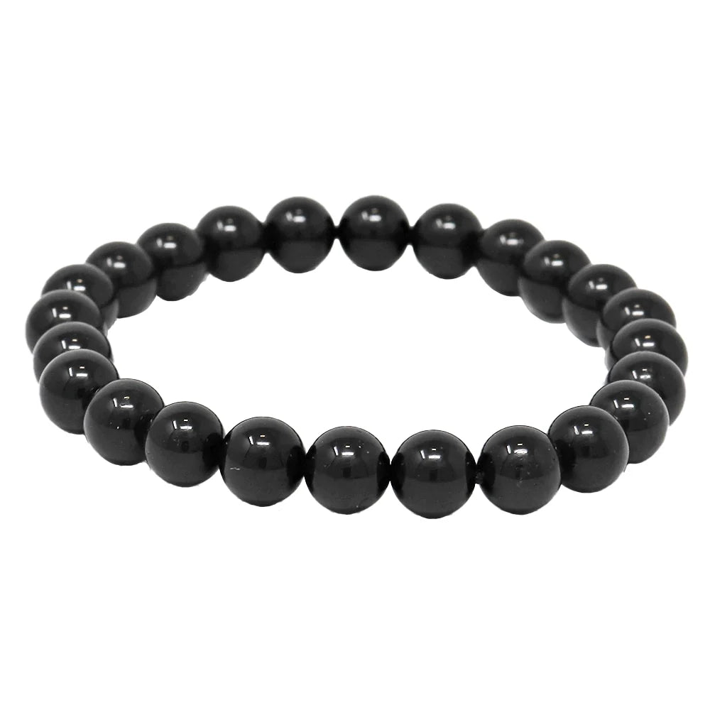 A black tourmaline bracelet with elastic string, featuring glossy black beads.
