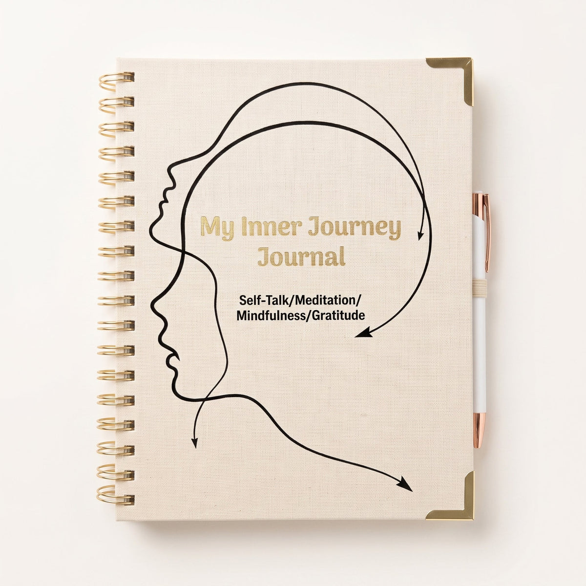 A beige spiral-bound journal with a black line-art profile of a head and gold text reading 'My Inner Journey Journal' and 'Self-Talk/Meditation/Mindfulness/Gratitude.' A white pen with a rose-gold cap rests against the right side.