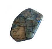 A polished labradorite stone with a smooth surface displaying its natural color variations - JOY - Journey Of You - Spiritual, Holistic, Empowering