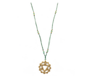 A delicate green chakra yoga necklace with a gold heart-shaped symbol and small green and gold beads - JOY - Journey Of You - Spiritual, Holistic, Empowering
