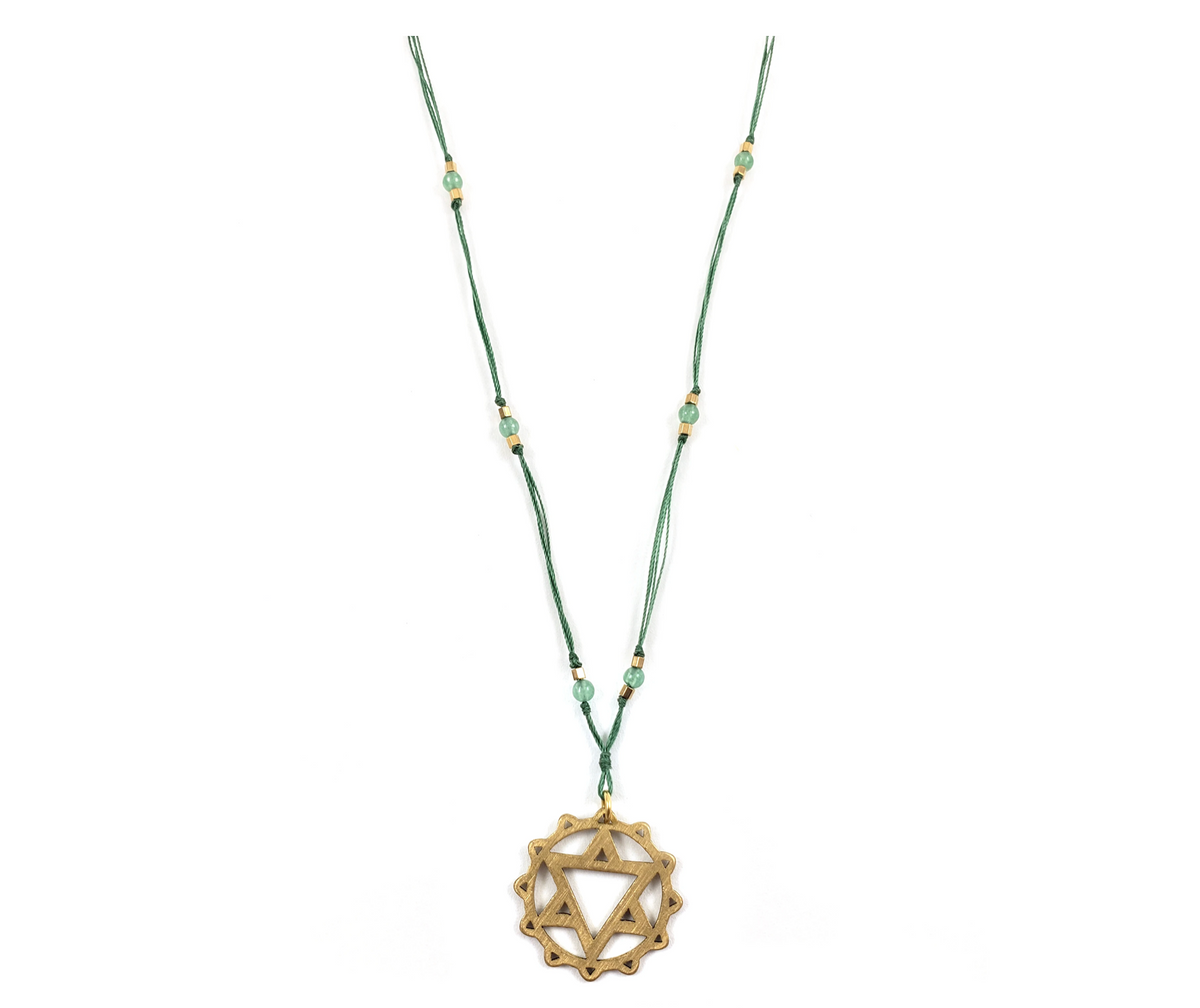 A delicate green chakra yoga necklace with a gold heart-shaped symbol and small green and gold beads - JOY - Journey Of You - Spiritual, Holistic, Empowering