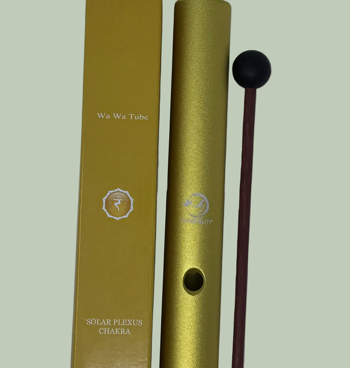 Gold tube with a mallet on a light gray background