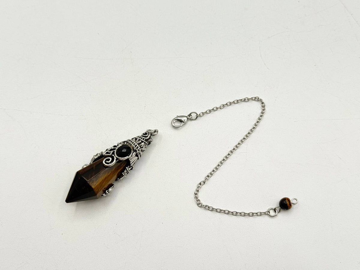 Black dagger-shaped pendant with chain on a white background