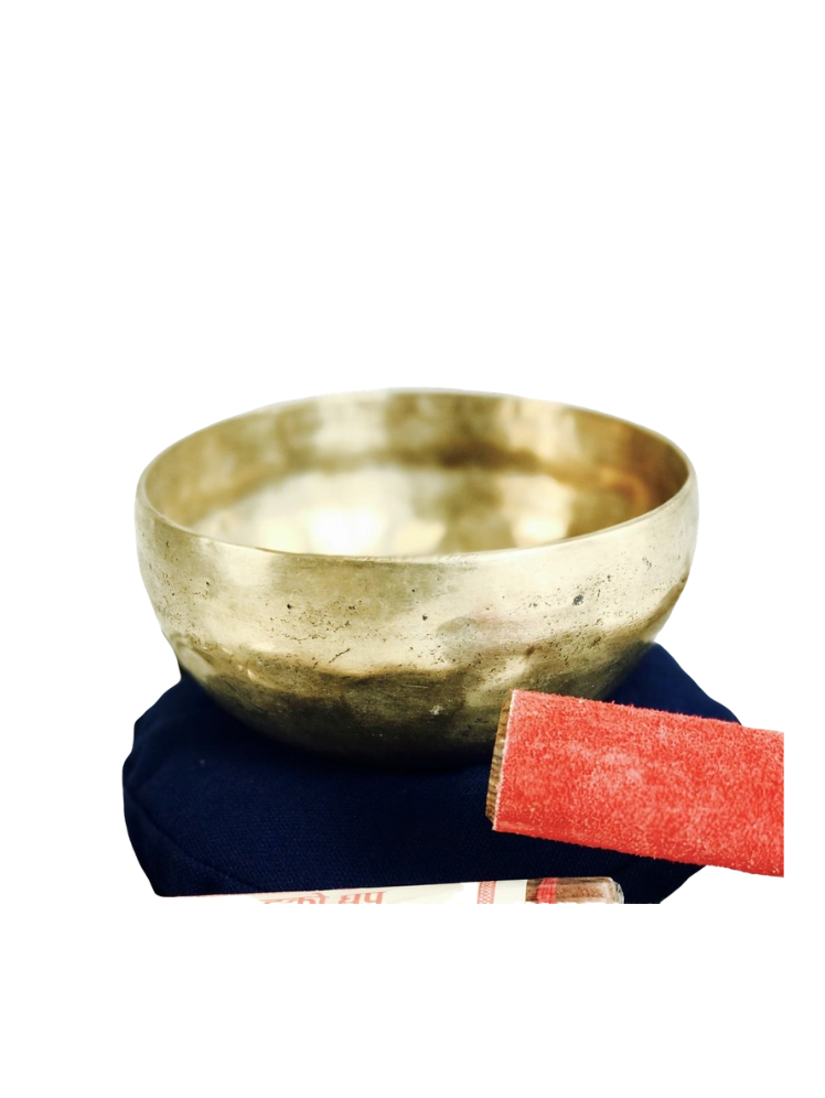 A hand hammered Tibetan singing bowl made of brass with a cushion and a wooden striker tool next to it, along with a package of incense - JOY - Journey Of You - Spiritual, Holistic, Empowering